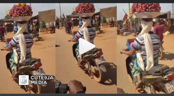"She Has PhD in Hawking" - Hawker Carries Bowl of Fruit on Her Head While Riding Motorcycle (Watch)